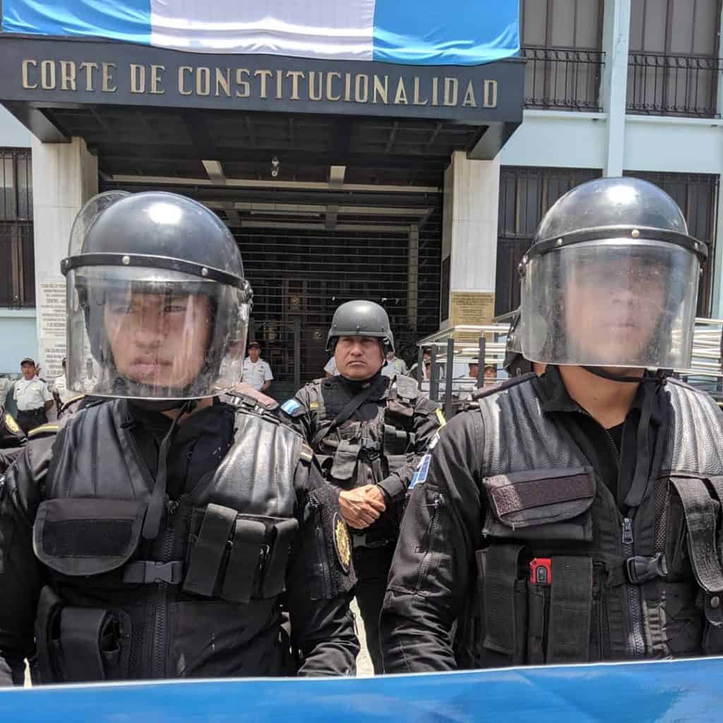 Police in riot gear block peaceful protestors from entering the Constitutional Court in Guatemala City. 