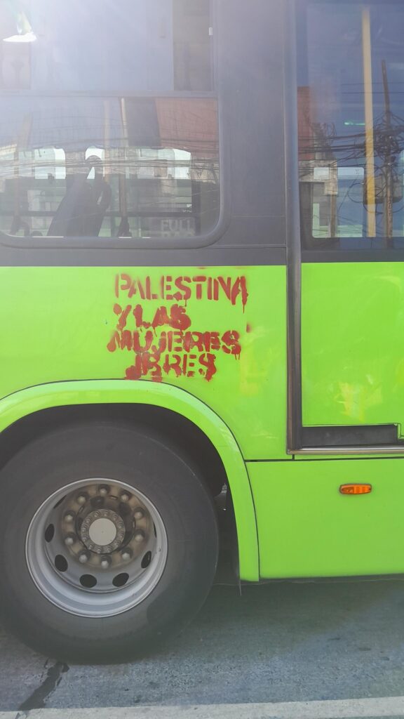 TransMetro bus with “Palestina y las mujeres libres” / “Free Palestine and free women” spray painted on it. March 8th, 2024, Guatemala City.