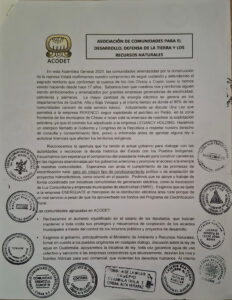 Black letters on white background. On the top there is the logo of the organisation and below and on the sides several stamps.