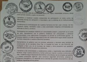 Black text on white background, zoom in of a document, there are several stamps.