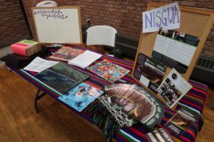 A table covered in NISGUA materials.