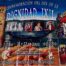 A large, colorful banner hung on a tiled ceiling, announcing the "Commemoration of the Day of Ixil Dignity." On the left side, a scroll-like graphic lists the names of the Seven Principales—Sebastián Cedillo, Pedro Guzmán, Vicente Guzmán, Juan Brito, Juan Brito Brito, Diego Cuchil, and Pedro Saloj—who were executed in 1936 for resisting forced labor. In the center and right, the banner features a collage of photographs: black-and-white images of community leaders, color portraits of people in traditional Ixil clothing, and stylized Indigenous artwork showing a group of figures in red, blue, and white garments. At the bottom, there are more event photos, maize kernels as background, and the phrase: “Defender el territorio es nuestro derecho” ("Defending the land is our right"). The banner credits the Ancestral Indigenous Municipal Authority Maya Ixil of Nebaj, Quiché, with organizing the event, held on June 21 and 22.