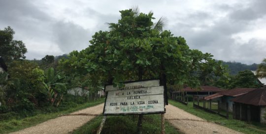 A sign in Copal AA reads: "Warning! No to the Xalalá Dam. Rivers for dignified life. Without electricity there is life, but without water there is not."