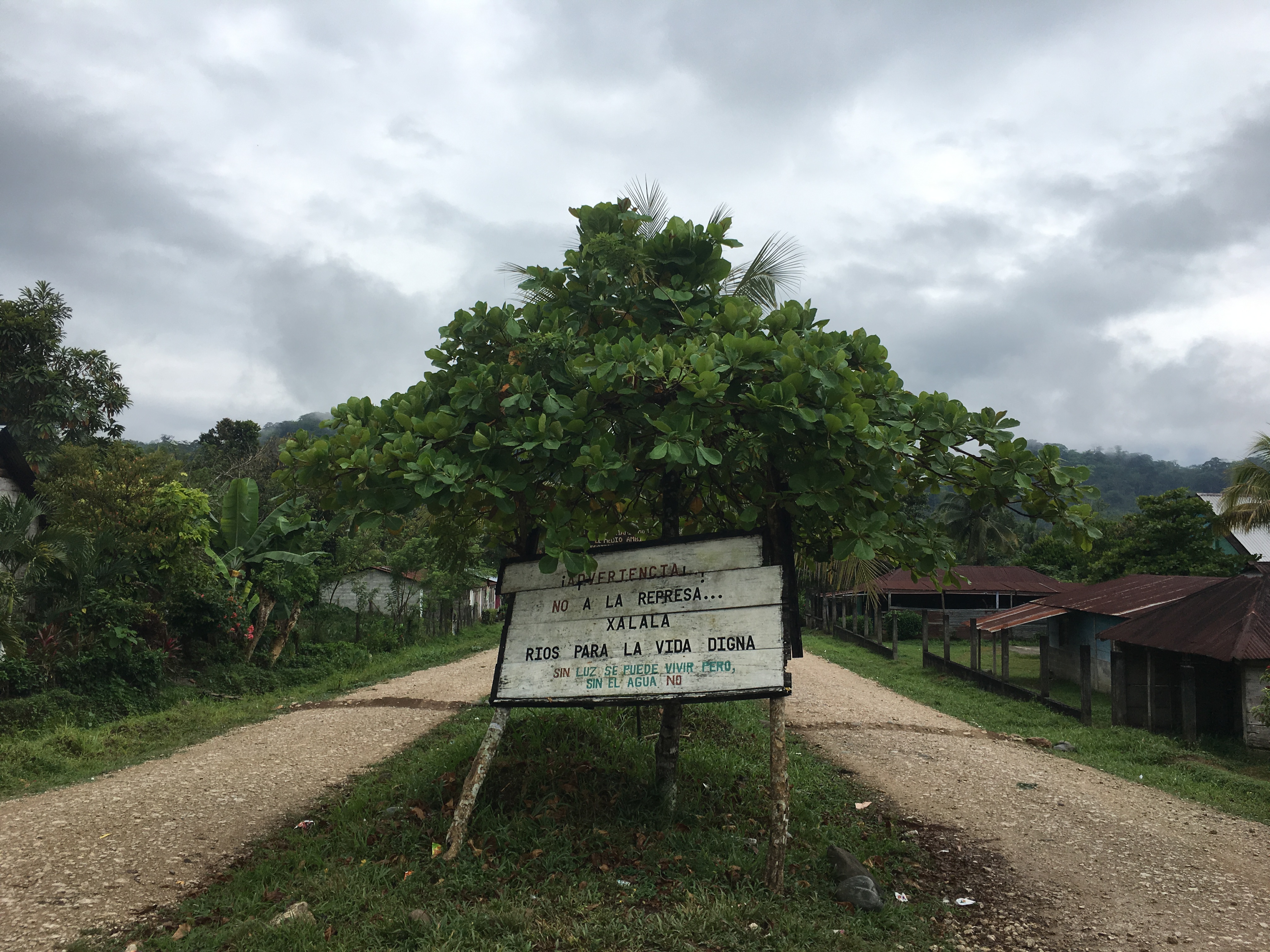 A sign in Copal AA reads: "Warning! No to the Xalalá Dam. Rivers for dignified life. Without electricity there is life, but without water there is not."