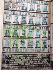 Photograph of a wall of the faces of people killed by the state during the Internal Armed Conflict in Guatemala.