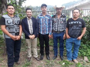 Quelvin Jiménez stands with Luis Fernando Garcia, Adolfo Garcia, Wilmer Pérez, and Misiel Alberto Martínez Sasvin, who survived an attack by Escobal mine private security in 2013. Quelvin represents the men as their lawyer as they seek justice.