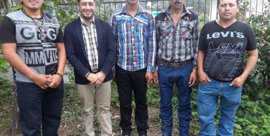 Quelvin Jiménez stands with Luis Fernando Garcia, Adolfo Garcia, Wilmer Pérez, and Misiel Alberto Martínez Sasvin, who survived an attack by Escobal mine private security in 2013. Quelvin represents the men as their lawyer as they seek justice.